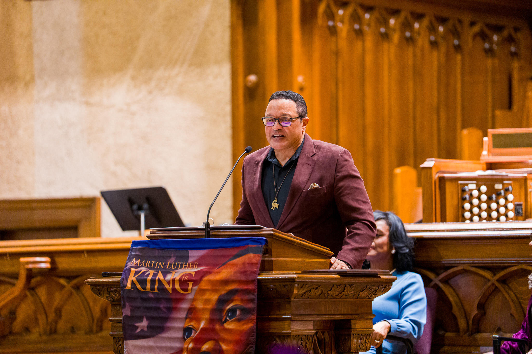 Community leader speaking at a Martin Luther King Jr. event