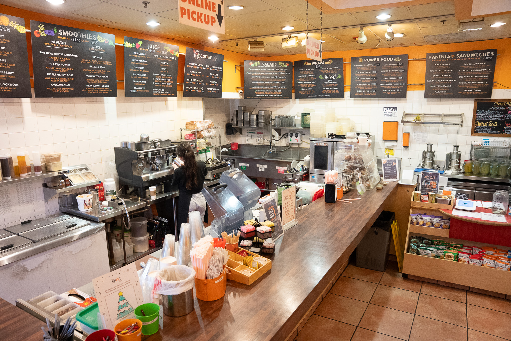 Inside The Spot Cafe in Pomona — menu boards and service counter