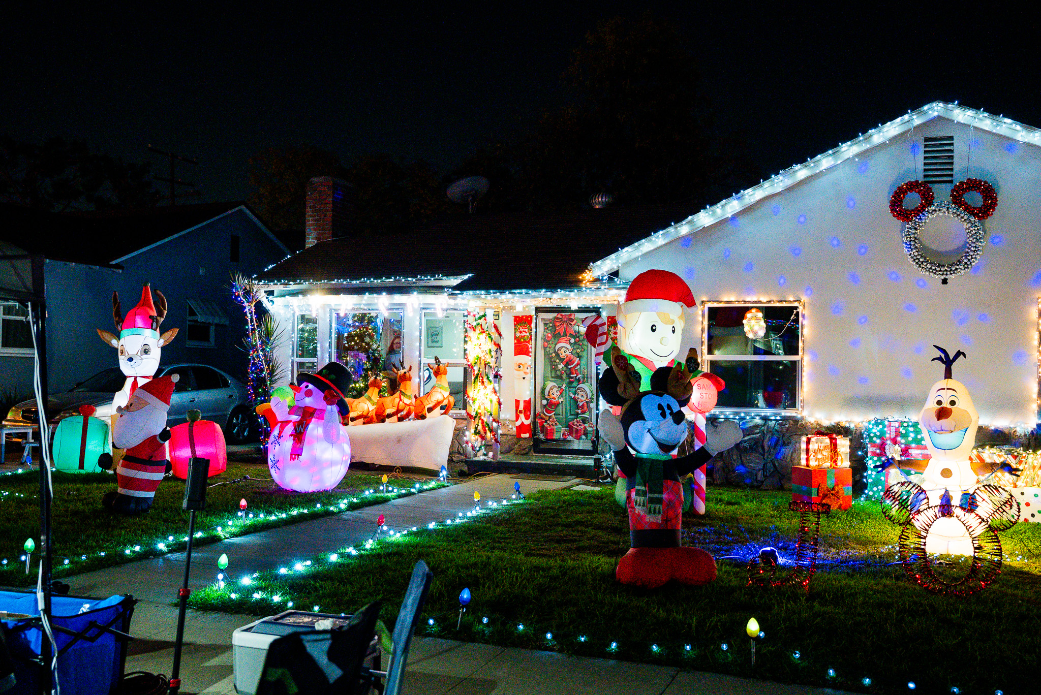 Filming a holiday lights display at night