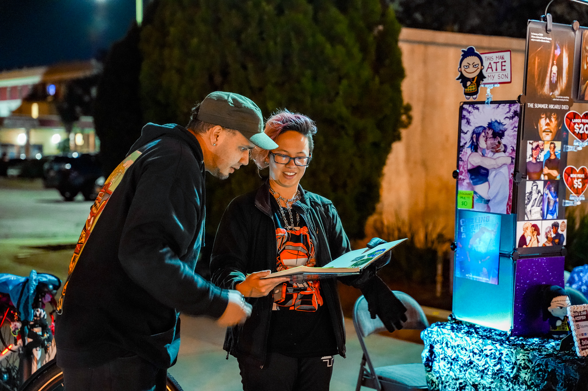 Residents reading a local print publication at an event